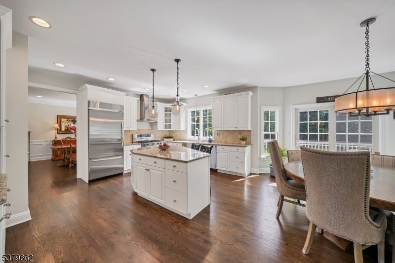 Chandelier, Dining room, Interior, Kitchen, Pendant Lights, Recessed Lighting, Stainless Steel Appliances, Wood Texture Flooring