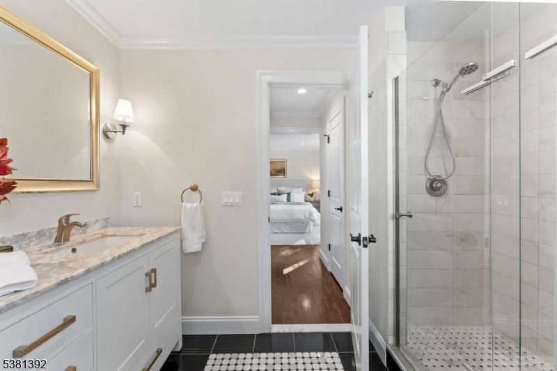 Bathroom, Bedroom, Dual Sink Vanities, Glass Shower, Interior, Recessed Lighting, Wood Texture Flooring