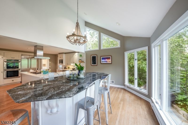 Chandelier, Interior, Kitchen, Pendant Lights, Recessed Lighting, Stainless Steel Appliances, Wood Texture Flooring