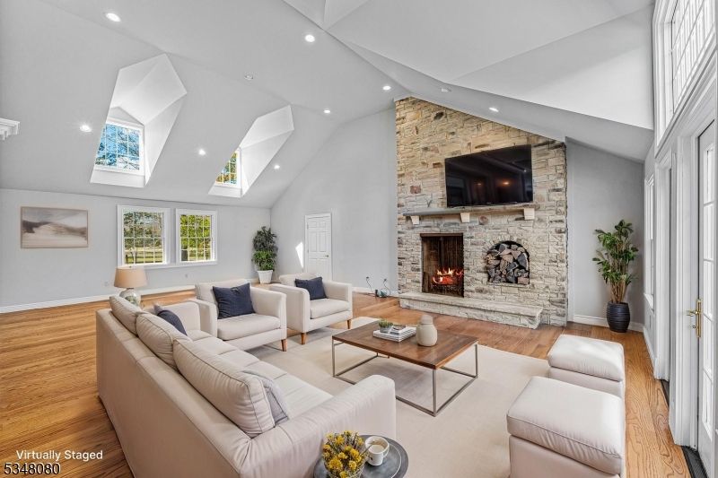 Fireplace, Interior, Living room, Recessed Lighting, Stone Walls, Wood Texture Flooring