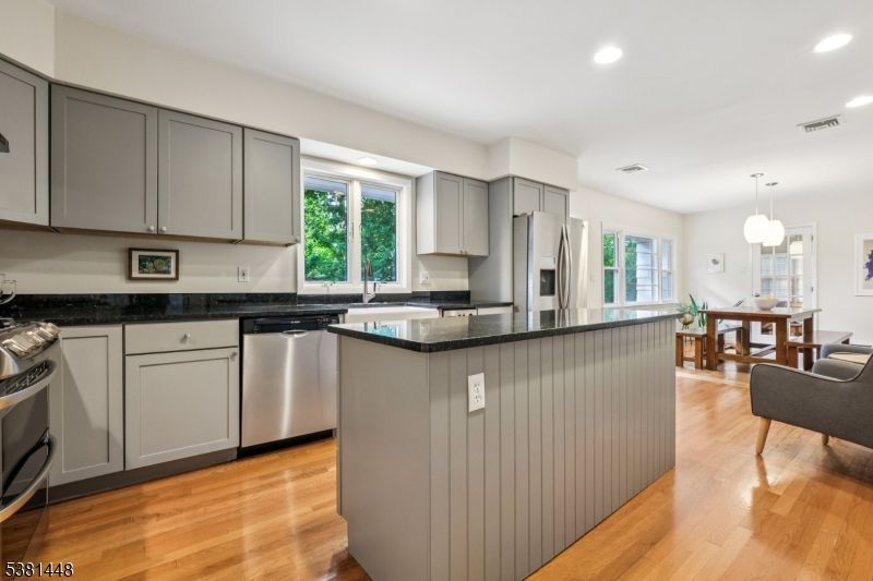Dining room, Interior, Kitchen, Pendant Lights, Recessed Lighting, Stainless Steel Appliances, Wood Texture Flooring