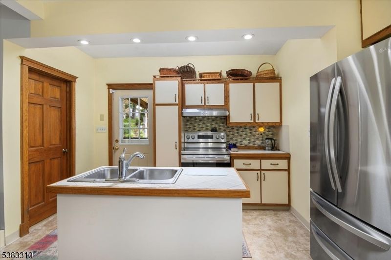Interior, Kitchen, Recessed Lighting, Stainless Steel Appliances, Tile Countertops