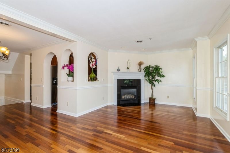 Chandelier, Empty room, Fireplace, Interior, Recessed Lighting, Wood Texture Flooring
