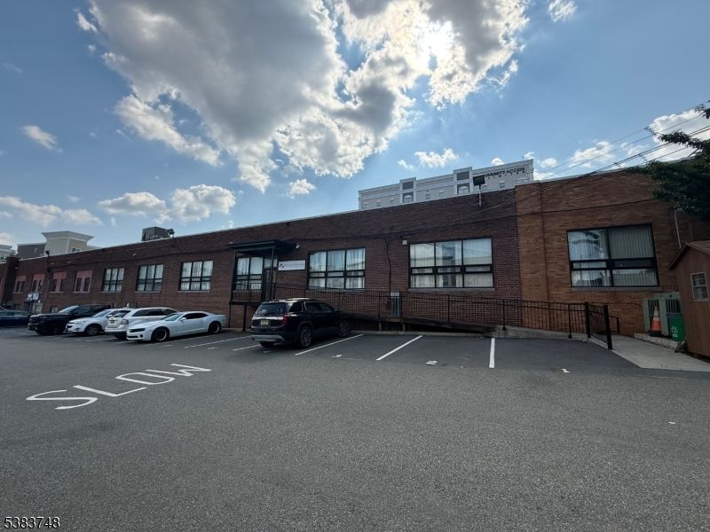 Exterior, Facade, Brick Facade, Condo Building