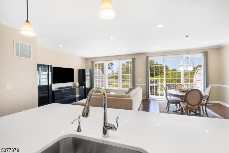 Chandelier, Dining room, Interior, Kitchen, Living room, Pendant Lights, Recessed Lighting, Wood Texture Flooring