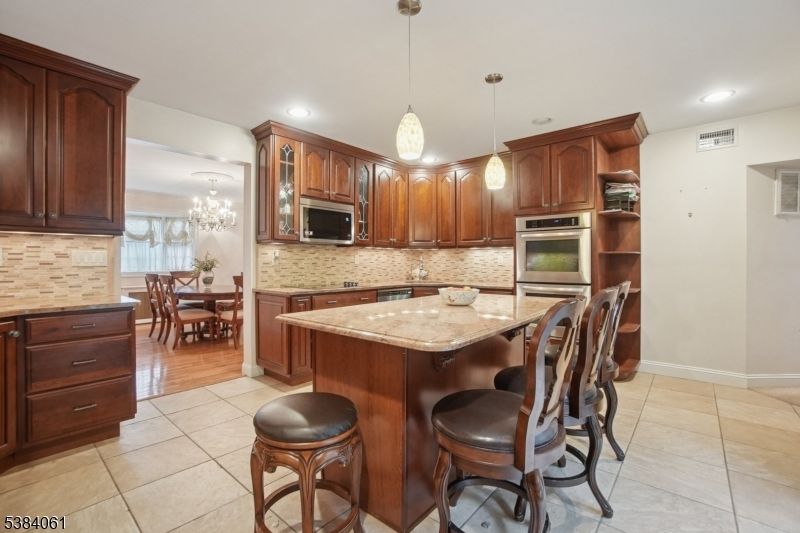 Chandelier, Dining room, Interior, Kitchen, Pendant Lights, Recessed Lighting, Stainless Steel Appliances
