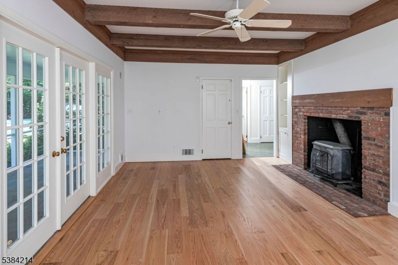 Empty room, Fireplace, Interior, Stone Walls, Wooden Beams, Wood Texture Flooring