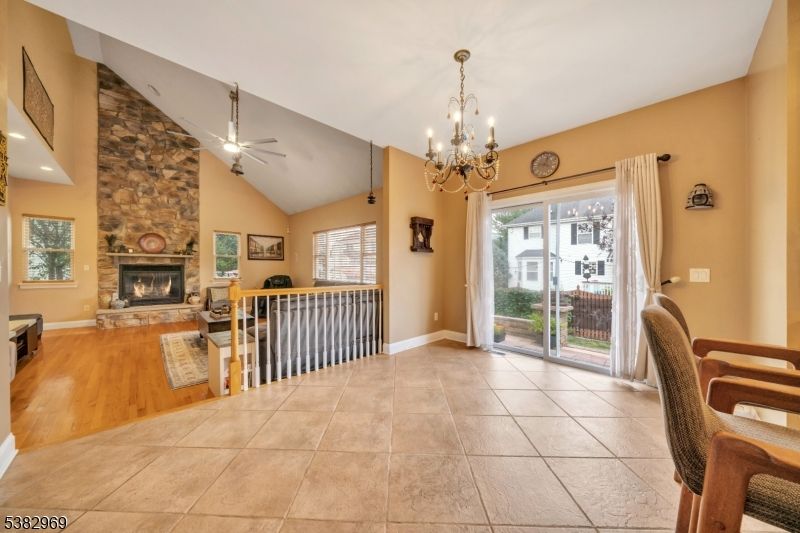 Chandelier, Fireplace, Interior, Living room, Stone Walls, Wood Texture Flooring
