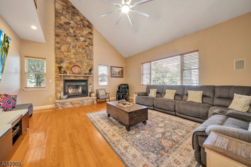Fireplace, Interior, Living room, Recessed Lighting, Stone Walls, Wood Texture Flooring