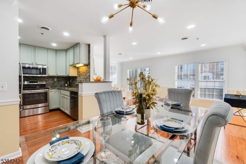 Dining room, Interior, Kitchen, Pendant Lights, Recessed Lighting, Stainless Steel Appliances, Wood Texture Flooring