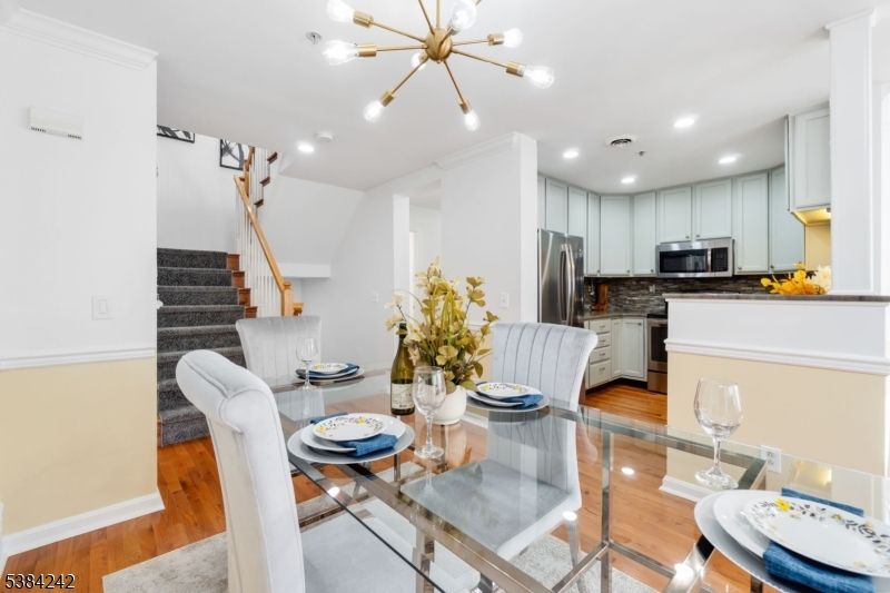 Dining room, Interior, Kitchen, Pendant Lights, Recessed Lighting, Stainless Steel Appliances, Wood Texture Flooring