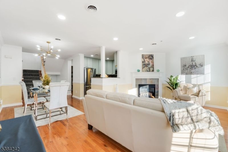 Dining room, Fireplace, Interior, Kitchen, Living room, Pendant Lights, Recessed Lighting, Stainless Steel Appliances, Wood Texture Flooring