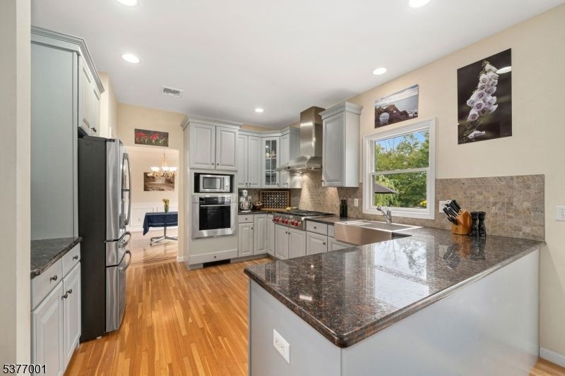 Chandelier, Interior, Kitchen, Recessed Lighting, Stainless Steel Appliances, Wood Texture Flooring