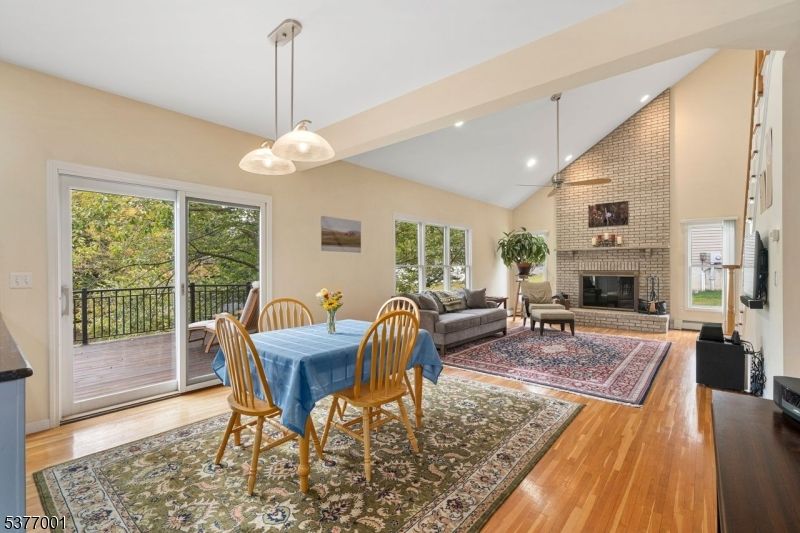 Dining room, Fireplace, Interior, Living room, Pendant Lights, Recessed Lighting, Stone Walls, Wood Texture Flooring