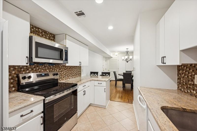 Chandelier, Dining room, Interior, Kitchen, Living room, Recessed Lighting, Stainless Steel Appliances, Wood Texture Flooring