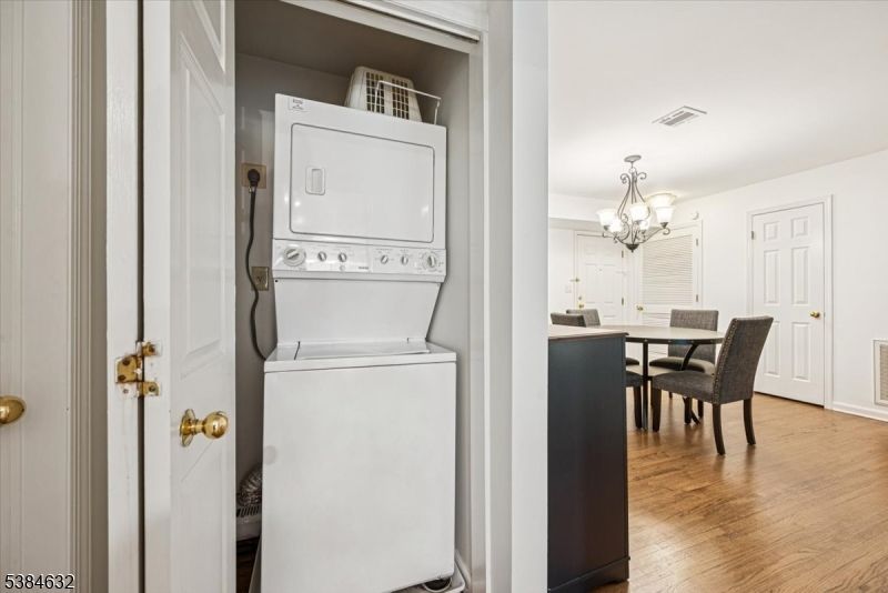 Chandelier, Dining room, Interior, Utility Closets, Washer, Wood Texture Flooring