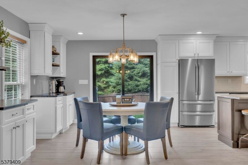 Dining room, Interior, Kitchen, Pendant Lights, Recessed Lighting, Stainless Steel Appliances, Wood Texture Flooring