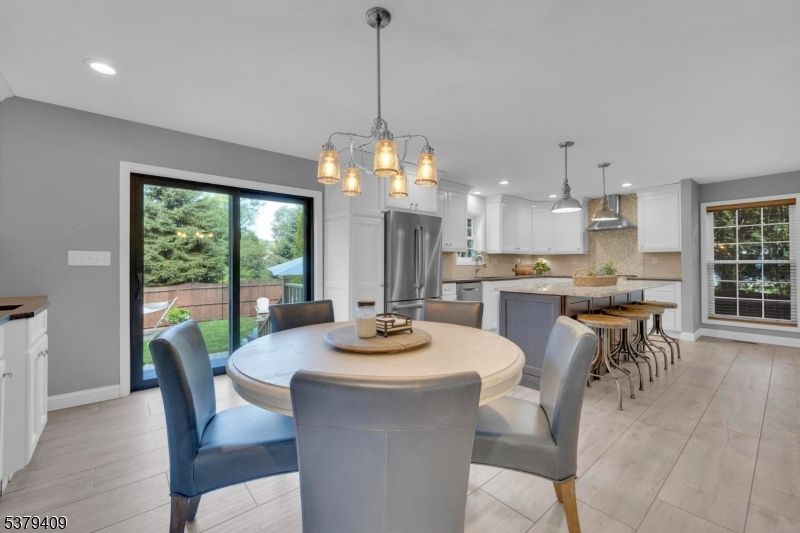 Dining room, Interior, Kitchen, Pendant Lights, Recessed Lighting, Stainless Steel Appliances, Wood Texture Flooring