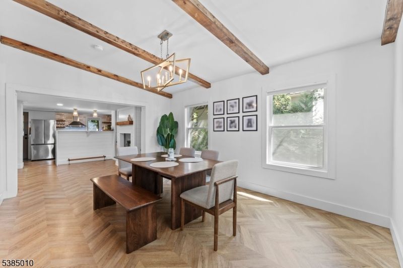 Chandelier, Dining room, Interior, Pendant Lights, Recessed Lighting, Stainless Steel Appliances, Wooden Beams, Wood Texture Flooring