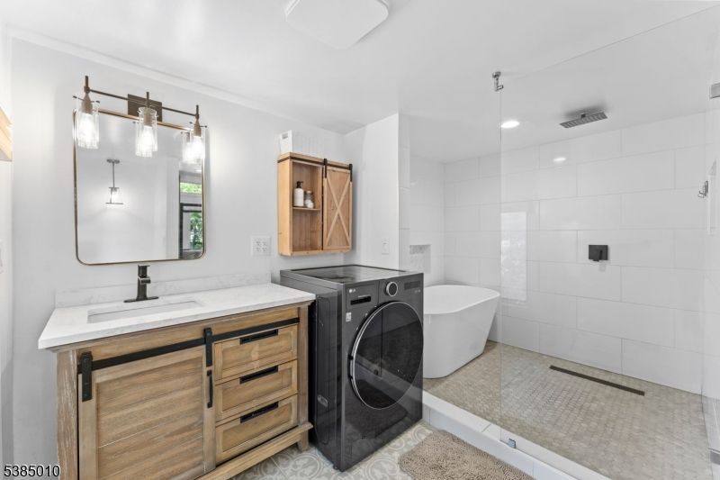 Bathroom, Dual Sink Vanities, Free Standing Baths, Glass Shower, Interior, Recessed Lighting, Washer