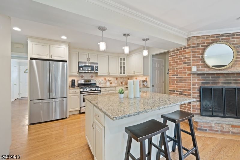 Interior, Kitchen, Pendant Lights, Recessed Lighting, Stainless Steel Appliances, Stone Walls, Wood Texture Flooring