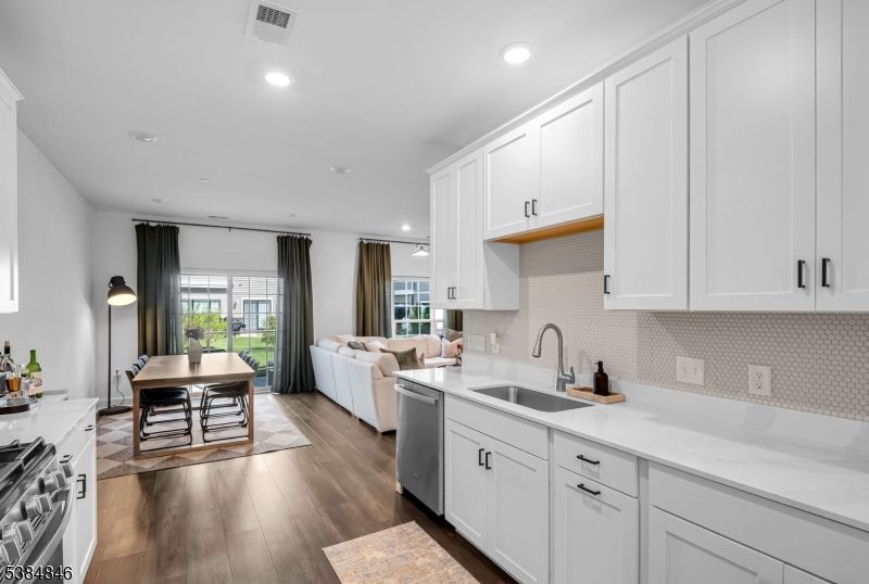 Dining room, Interior, Kitchen, Living room, Recessed Lighting, Stainless Steel Appliances, Wood Texture Flooring