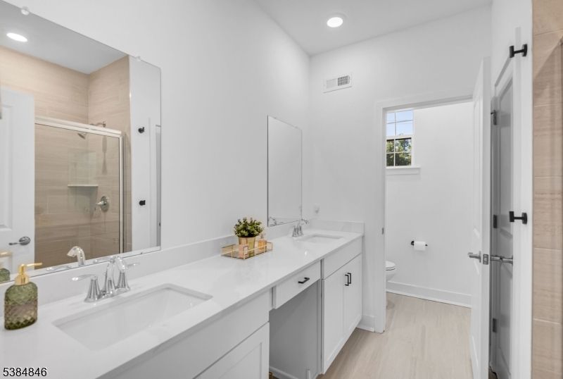 Bathroom, Dual Sink Vanities, Glass Shower, Interior, Recessed Lighting, Wood Texture Flooring