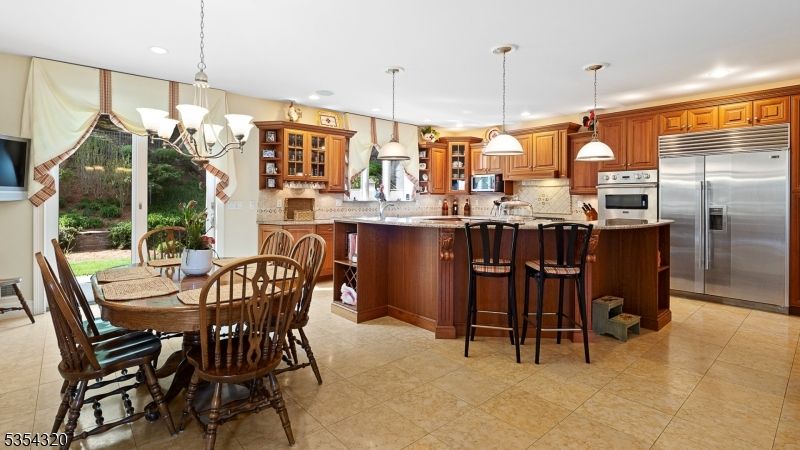Chandelier, Dining room, Interior, Kitchen, Pendant Lights, Recessed Lighting, Stainless Steel Appliances