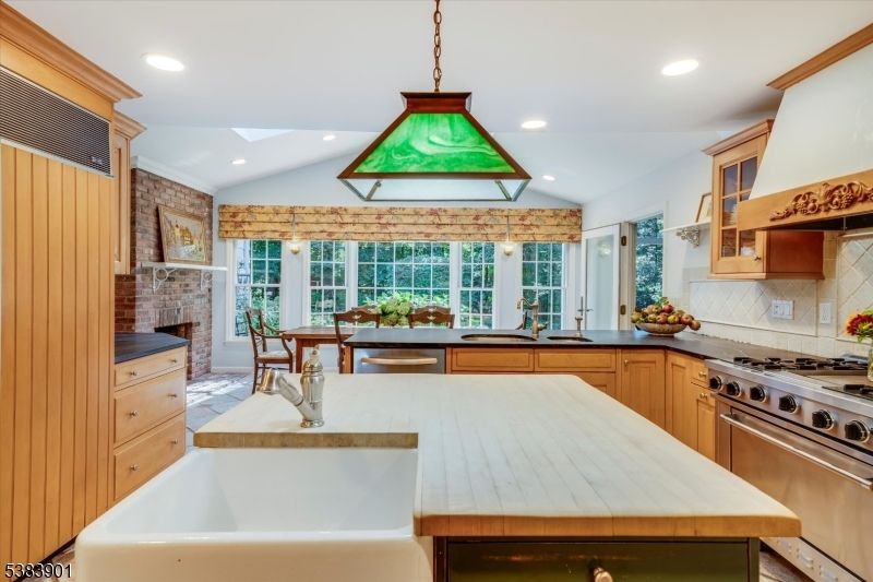 Dining room, Fireplace, Interior, Kitchen, Pendant Lights, Recessed Lighting, Stainless Steel Appliances, Stone Walls