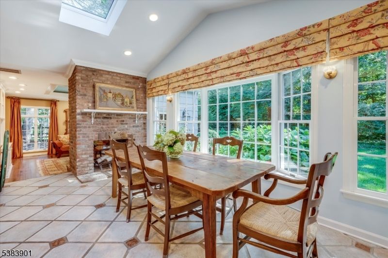 Dining room, Fireplace, Interior, Recessed Lighting, Stone Walls, Wood Texture Flooring