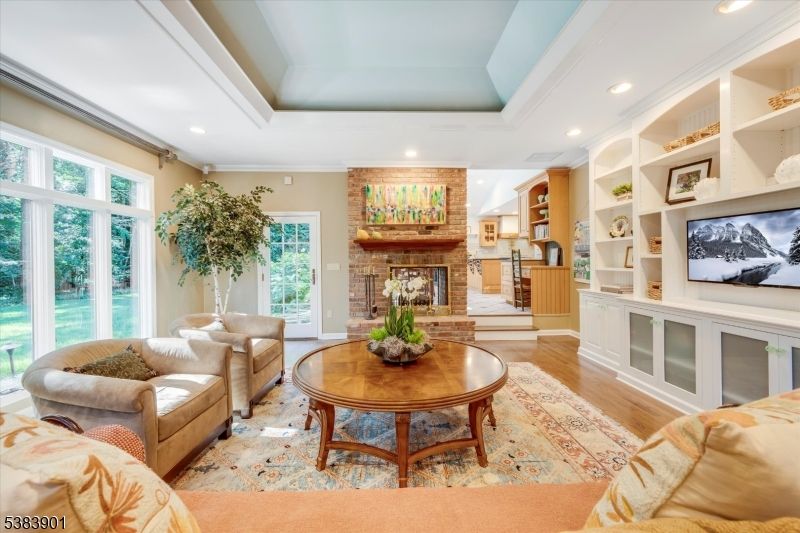 Fireplace, Interior, Living room, Recessed Lighting, Stone Walls, Wood Texture Flooring