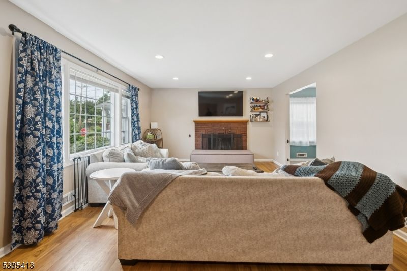 Fireplace, Interior, Living room, Recessed Lighting, Wood Texture Flooring