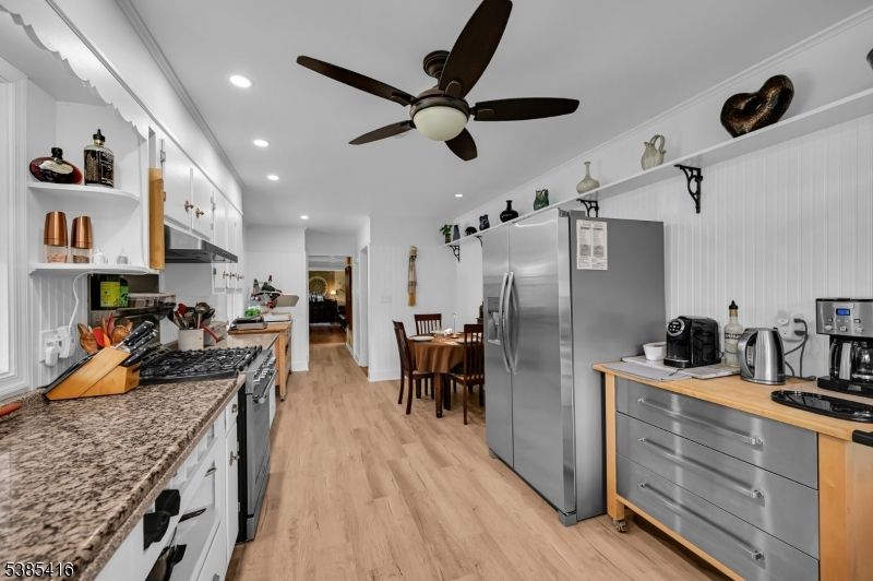 Dining room, Interior, Kitchen, Recessed Lighting, Stainless Steel Appliances, Wood Texture Flooring