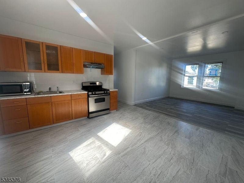 Interior, Kitchen, Marble, Recessed Lighting, Stainless Steel Appliances, Wood Texture Flooring