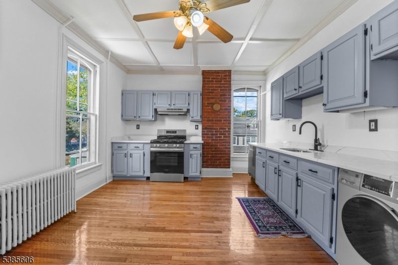 Interior, Kitchen, Stainless Steel Appliances, Stone Walls, Washer, Wood Texture Flooring