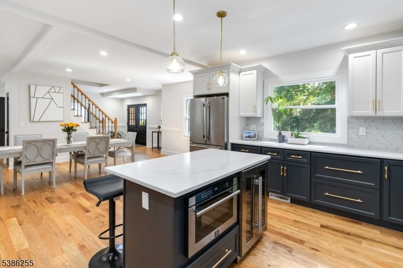 Dining room, Interior, Kitchen, Pendant Lights, Recessed Lighting, Stainless Steel Appliances, Wood Texture Flooring