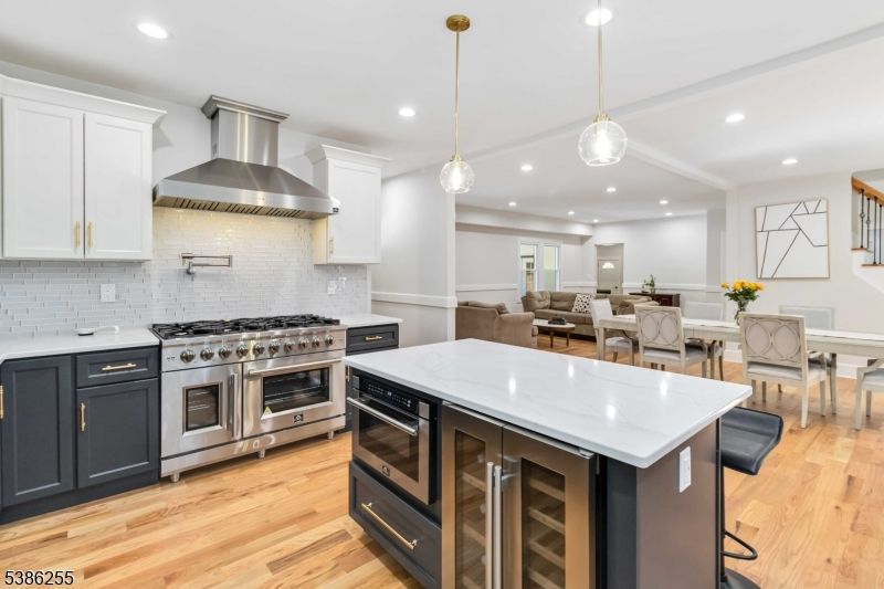 Dining room, Interior, Kitchen, Pendant Lights, Recessed Lighting, Stainless Steel Appliances, Wood Texture Flooring
