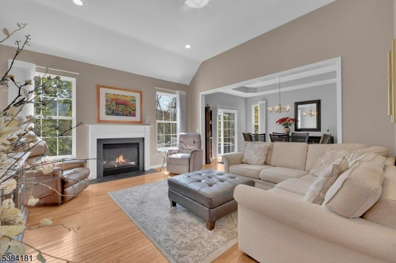 Chandelier, Dining room, Fireplace, Interior, Living room, Pendant Lights, Recessed Lighting, Wood Texture Flooring