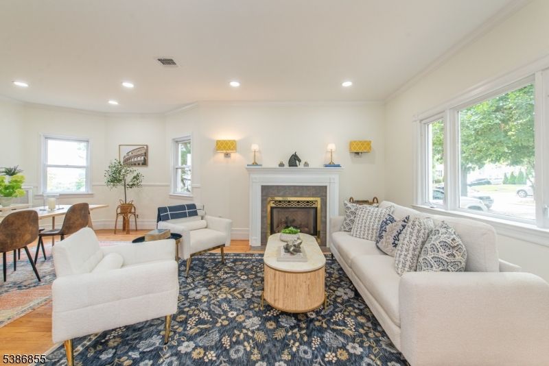 Dining room, Fireplace, Interior, Living room, Recessed Lighting, Wood Texture Flooring
