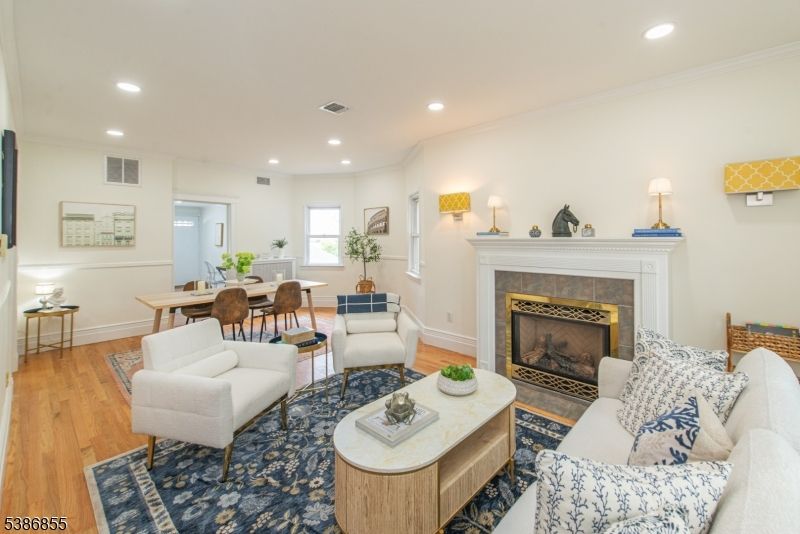 Dining room, Fireplace, Interior, Living room, Recessed Lighting, Wood Texture Flooring