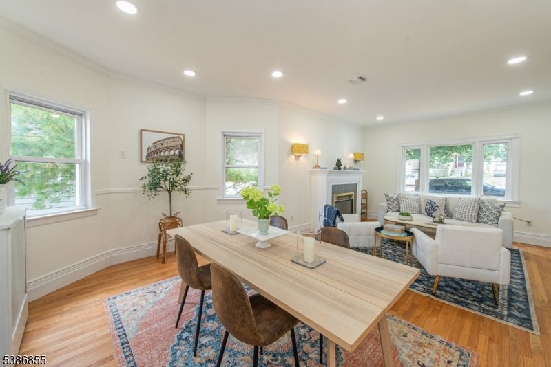 Dining room, Fireplace, Interior, Living room, Recessed Lighting, Wood Texture Flooring