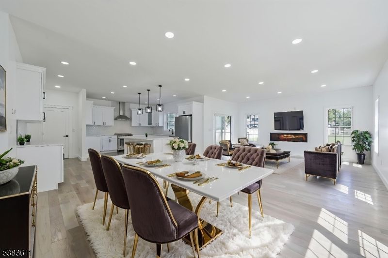 Dining room, Fireplace, Interior, Kitchen, Living room, Pendant Lights, Recessed Lighting, Stainless Steel Appliances, Wood Texture Flooring