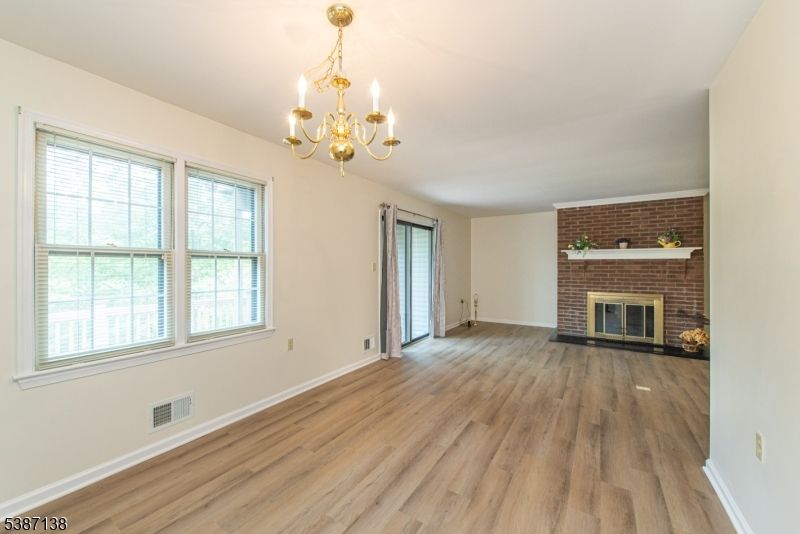 Chandelier, Empty room, Fireplace, Interior, Stone Walls, Wood Texture Flooring