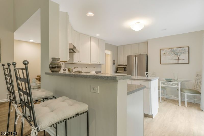 Dining room, Interior, Kitchen, Recessed Lighting, Stainless Steel Appliances, Wood Texture Flooring