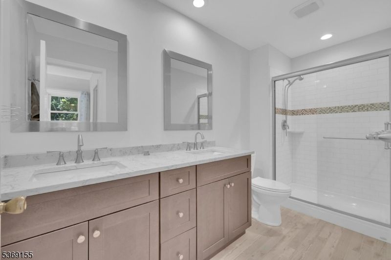 Bathroom, Dual Sink Vanities, Glass Shower, Interior, Recessed Lighting, Wood Texture Flooring