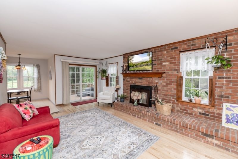 Fireplace, Interior, Living room, Pendant Lights, Stone Walls, Wood Texture Flooring