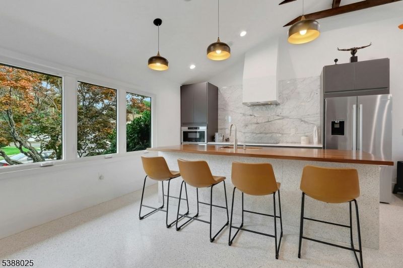 Interior, Kitchen, Marble Walls, Pendant Lights, Recessed Lighting, Stainless Steel Appliances