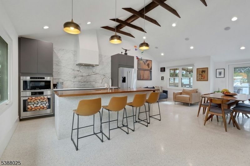 Dining room, Interior, Kitchen, Marble Walls, Pendant Lights, Recessed Lighting, Stainless Steel Appliances, Wooden Beams