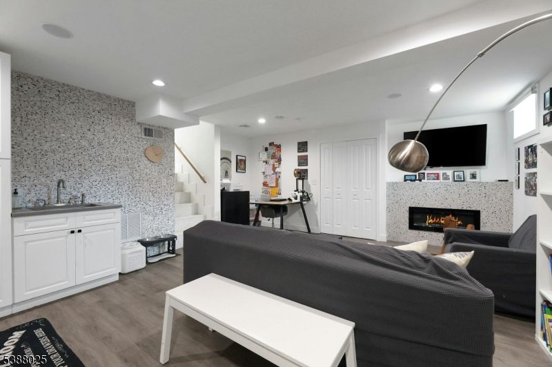 Bedroom, Fireplace, Interior, Living room, Recessed Lighting, Wood Texture Flooring