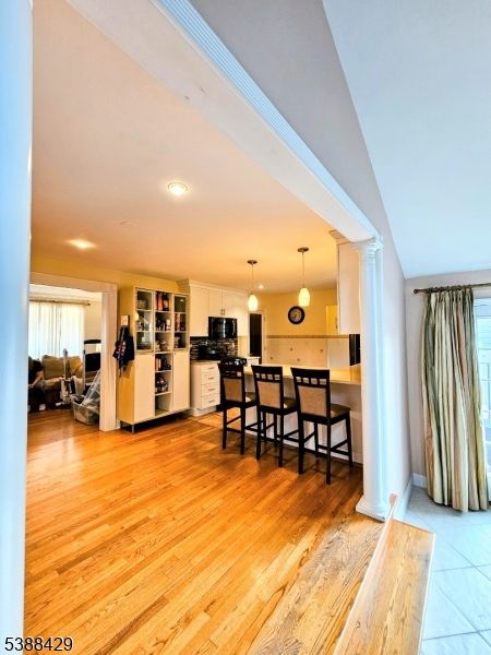 Dining room, Interior, Kitchen, Pendant Lights, Recessed Lighting, Stainless Steel Appliances, Wood Texture Flooring